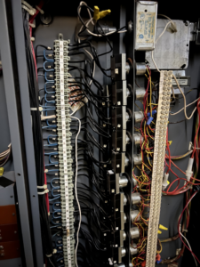 A close-up of intricate electrical panel wiring and terminal blocks installed by TJAM Electric in Springtown, TX.