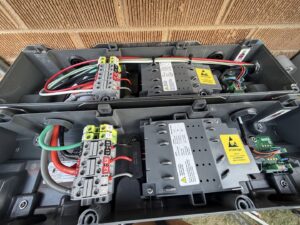 Close-up view of electrical wiring and components inside a panel by Pioneer Electric LLC in West Valley City, UT.