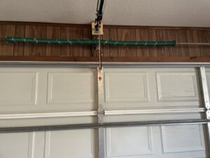 Close-up view of a garage door torsion spring system, a common repair by Precision Door Service of Huntsville, AL.