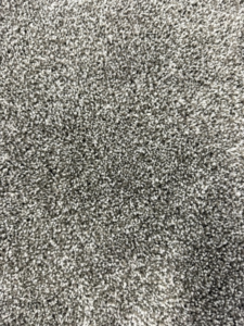 A close-up view of a soft grey carpet texture installed by Lakefront Flooring in Erie, PA.