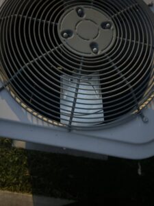 A close-up view of the fan inside an outdoor HVAC condenser unit serviced by Sterling Service of Florida Inc in Tallahassee, FL.