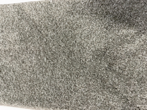 A close-up view of a light grey carpet texture installed by Lakefront Flooring in Erie, PA.