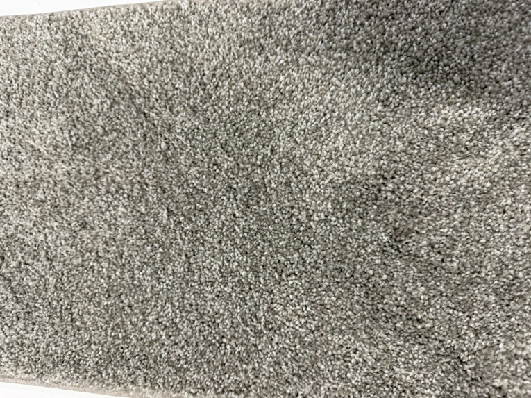 A close-up view of a light grey carpet texture installed by Lakefront Flooring in Erie, PA.