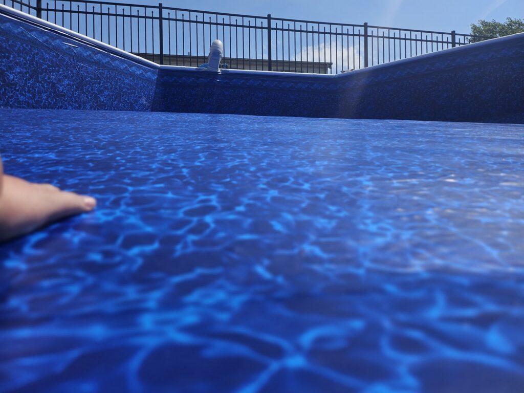 A close-up view of a new blue pool liner, highlighting quality liner installation by Westside Pools in Owensboro, KY.