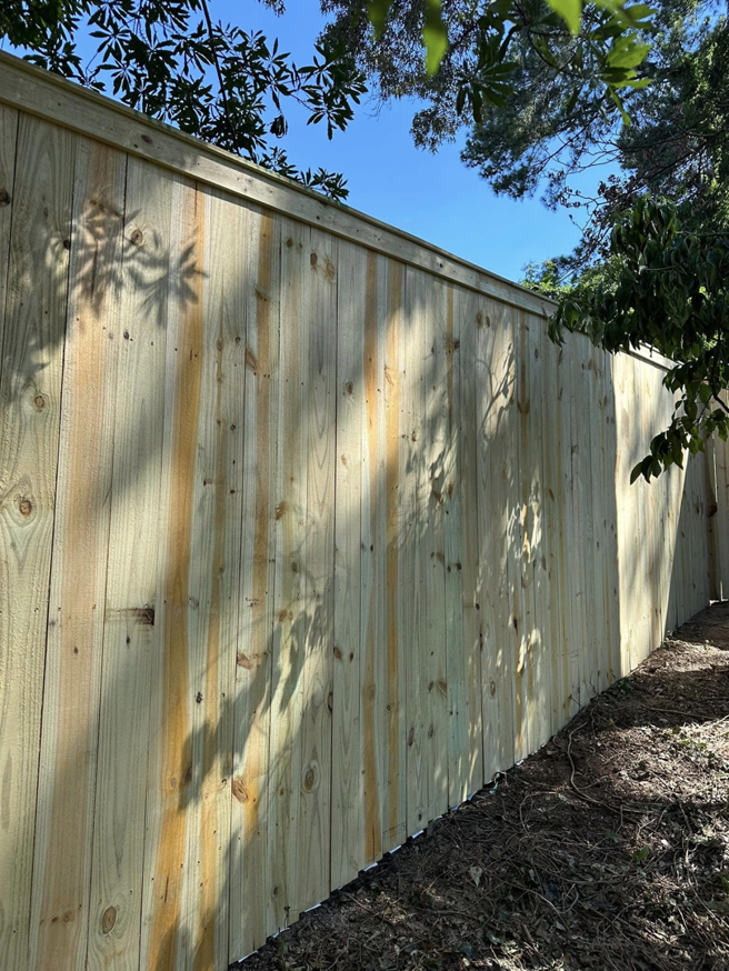 Close-up view of new wood fence panels installed by First in Fencing and Remodeling in Fayetteville, NC.