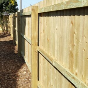 A close-up view of newly installed wooden fence panels, showcasing quality work by T&G Outdoor Services in Austin, TX.