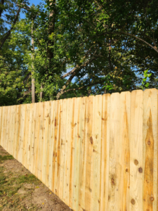 A close-up view of a newly installed wooden privacy fence showcasing the quality of work by Tussing's Fence in Ann Arbor, MI.