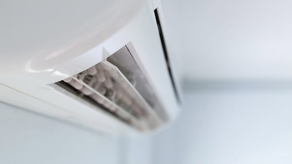 A close-up view of a modern wall-mounted mini-split AC unit, installed by NorthStar Services in South Haven, MN