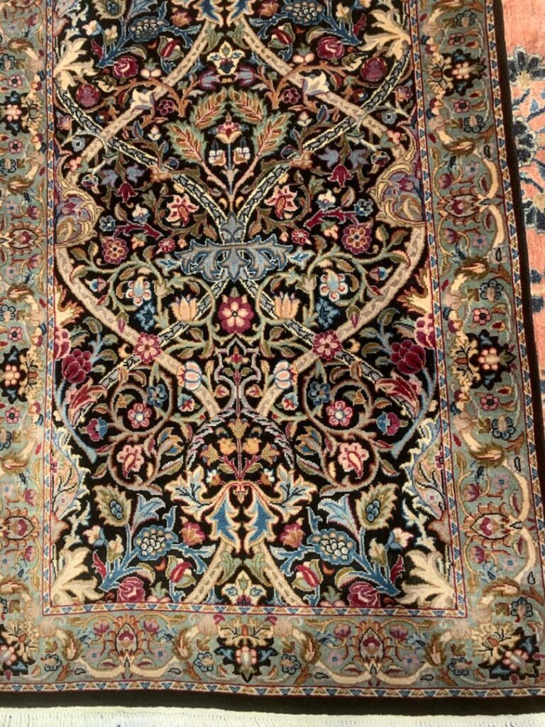 A close-up view of an ornate, detailed oriental rug pattern from J and J Oriental Rug Gallery in Alexandria, VA.