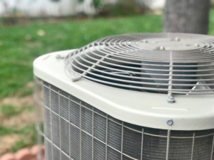 A close-up view of an outdoor air conditioning unit, representing HVAC services from Climate Control in San Antonio, TX