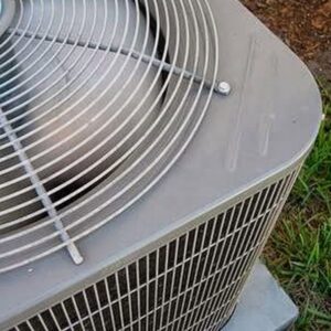 A close-up view of the fan and top of an outdoor AC unit, serviced by Dodson A/C & Appliance in Biloxi, MS.