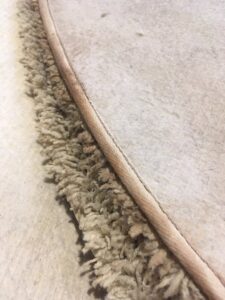 Close-up view of a rug edge with professional binding, showcasing quality craftsmanship at Zakian Rug Cleaning in Philadelphia, PA