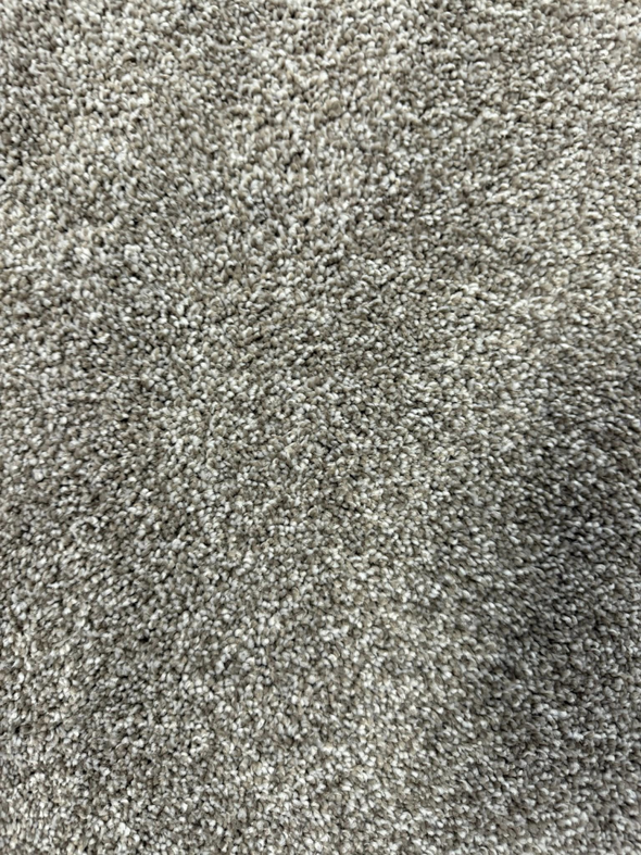 A close-up view of a warm tan carpet texture installed by Lakefront Flooring in Erie, PA.