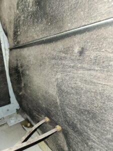 Very dirty, dusty surface inside an HVAC system, highlighting the need for cleaning by DUCTZ of Siouxland in Vermillion, SD.