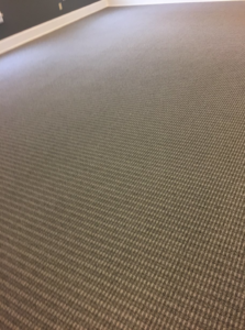 A close-up view of a professionally installed patterned carpet floor by Tony Trujillo Flooring Sales & Installation in Franklin, TN.