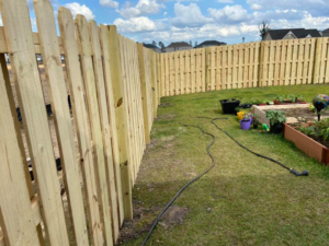 A close-up view of a newly installed wooden privacy fence by All In One Fence in Whitehouse Station, NJ.