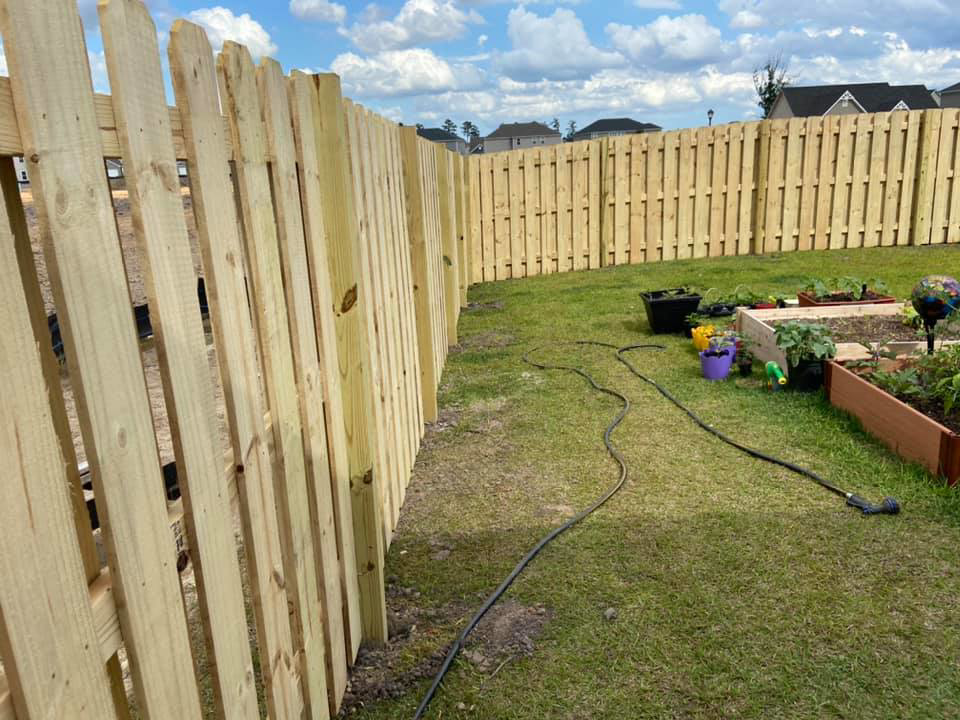 A close-up view of a newly installed wooden privacy fence by All In One Fence in Whitehouse Station, NJ.