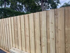 A close-up view of a newly installed wooden privacy fence by Allende J. Service Corp in Miami, FL.