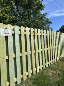 A close-up view of a newly installed wooden privacy fence, showcasing the work of D&M Renovation Services LLC in Columbus, OH.