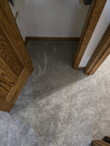 A small closet area featuring a new light grey carpet installation by Rosas Carpet & Flooring in Shorewood, IL.