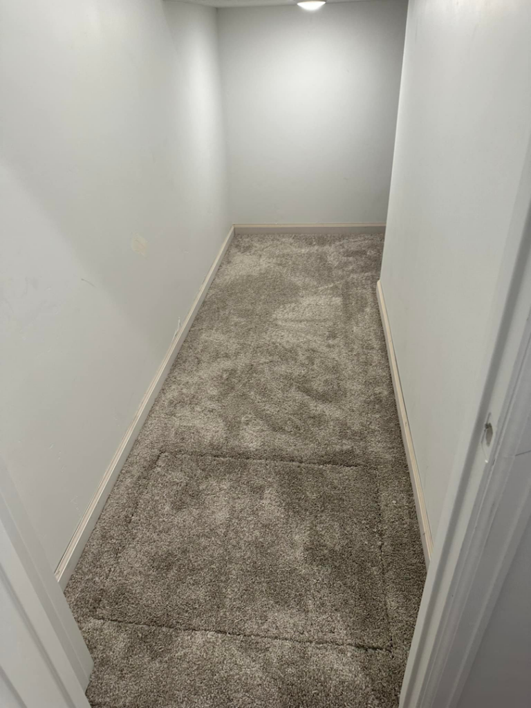 Professional grey carpet installation in a narrow closet by Millennium Flooring .Co in Salt Lake City, UT.
