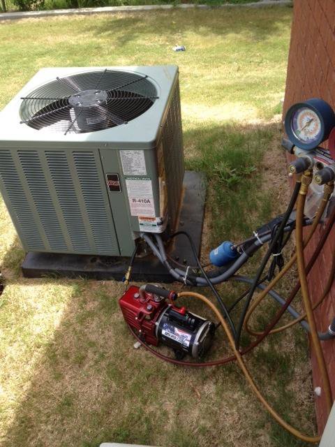 A cluttered garage or storage area needing general junk removal by Climate Control, LLC in Albany, GA.