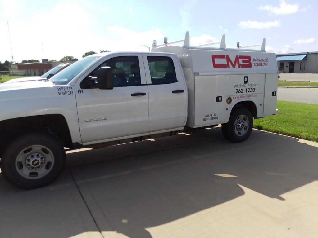 A white CM3, Inc. HVAC service truck parked in Wichita, KS, ready for commercial and residential jobs.