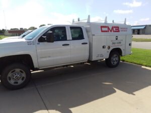A white CM3, Inc. HVAC service truck parked in Wichita, KS, ready for commercial and residential jobs.