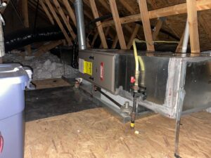 A Coleman furnace and air handler unit installed in an attic space by Luciano's Air Services in Durham, NC.