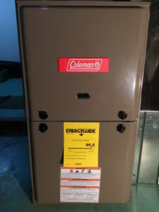 A Coleman brand furnace or air handler unit with an EnergyGuide label, installed by Semenik Hvac/r in Spokane, WA.