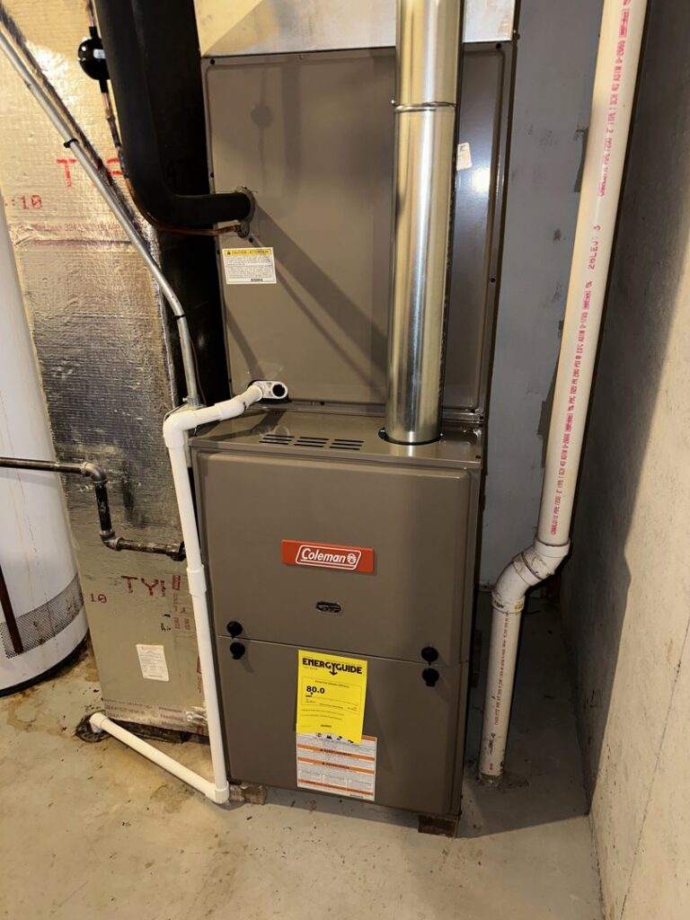 A Coleman indoor furnace unit with ductwork, installed by Nacho Heating & Cooling Plus Co. in Crest Hill, IL