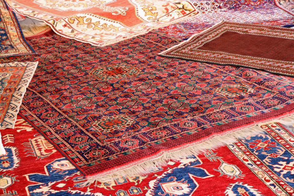 A collection of ornate area rugs, showcasing the types of carpets handled by J L Williard Carpet Care in High Point, NC.
