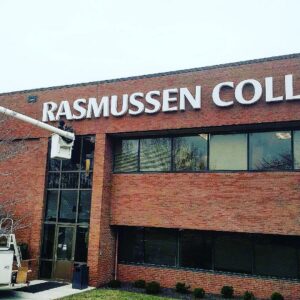 Lumenus Technologies, LLC performing electrical repair on a college sign in Lenexa, KS.