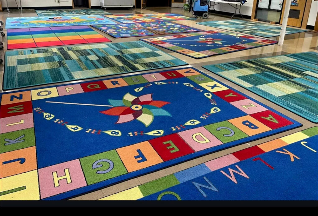 Several colorful area rugs laid out after professional cleaning, ready for use by Ype Cleaning LLC in Monroe, NC.