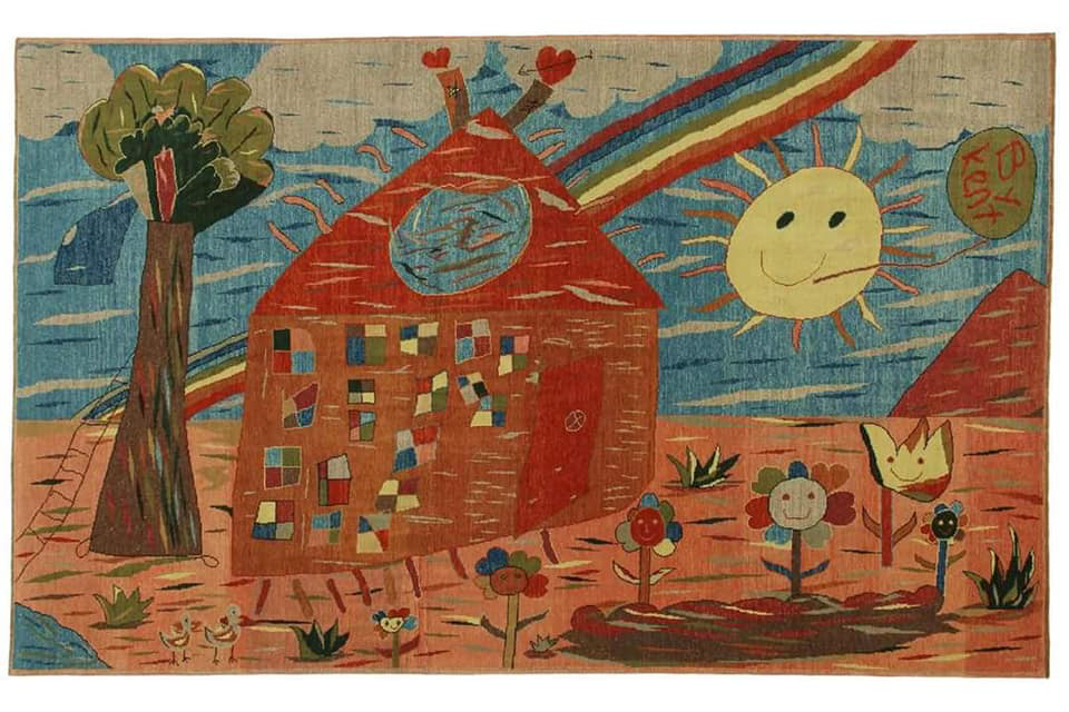 A colorful carpet featuring a whimsical children's design, offered by Woven Legends in Philadelphia, PA.