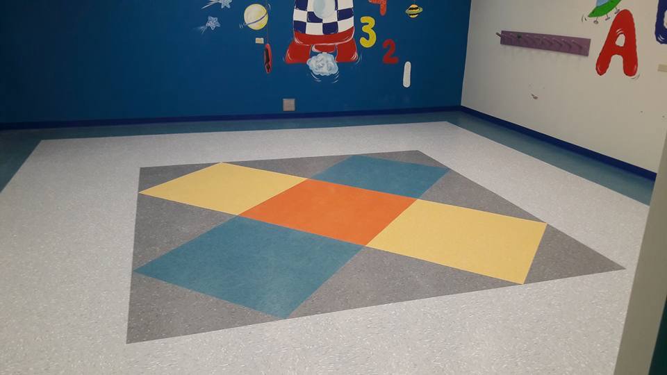 A vibrant, colorful patterned flooring installation completed by Carpets Texas in El Paso, TX.