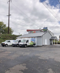 Comfort Temps HVAC service vans parked outside the business building in Gainesville, FL