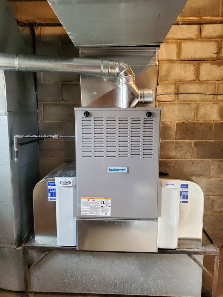 A Comfortmaker furnace and air handler unit with ductwork installed by Bouvy Heating & Air Conditioning Services in Pittsburgh, PA.