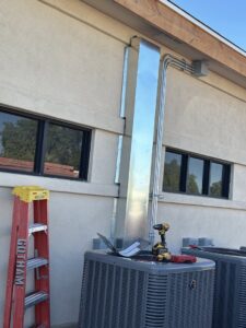 Commercial AC units with new ductwork and electrical conduit installed by Gotham Air LLC in Glendale, AZ.