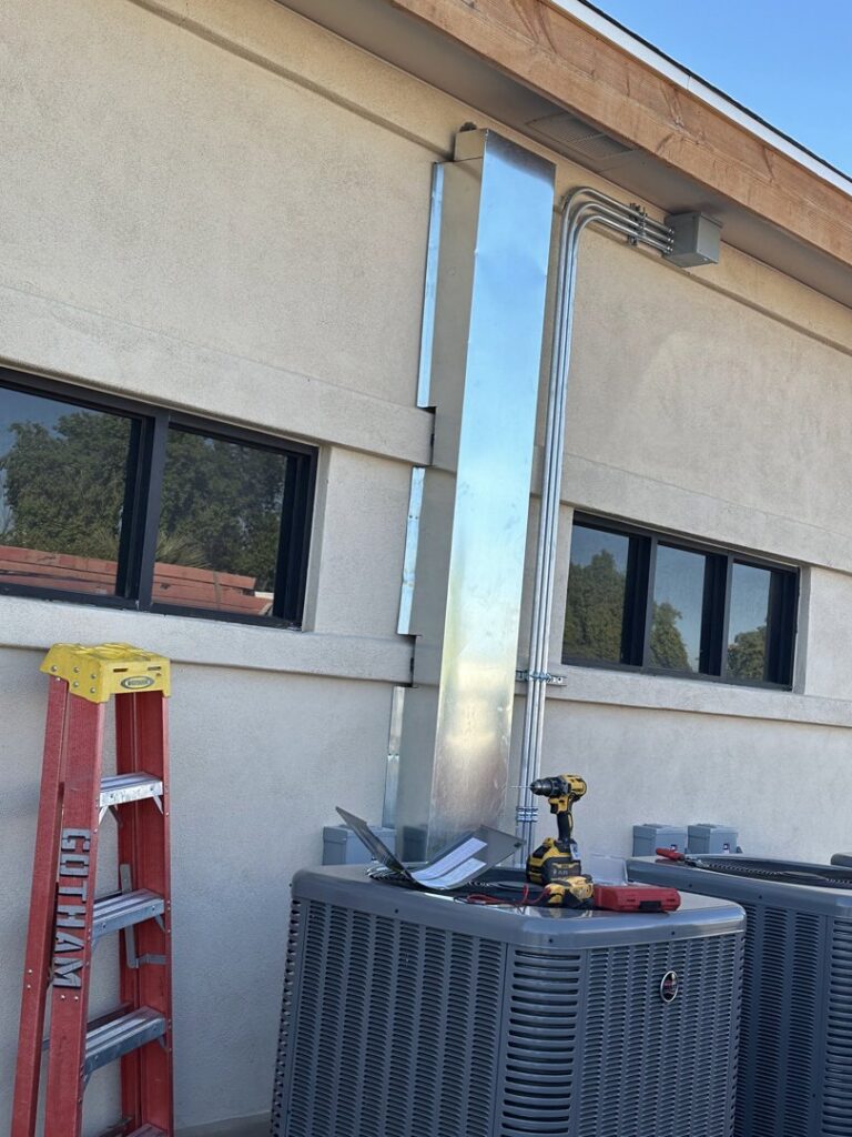 Commercial AC units with new ductwork and electrical conduit installed by Gotham Air LLC in Glendale, AZ.