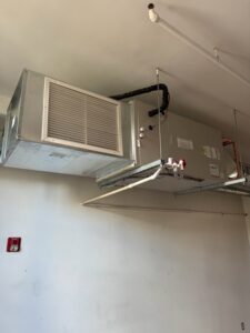 A large commercial air handler unit installed on a ceiling by Evergreen Services in Warwick, RI.