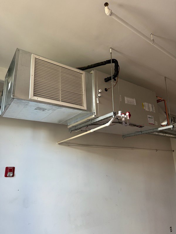 A large commercial air handler unit installed on a ceiling by Evergreen Services in Warwick, RI.