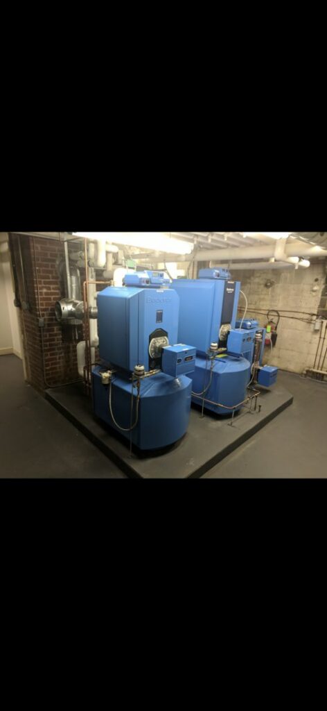 Large blue commercial boilers and heating system installation by Mason Mechanical Services LLC HVAC Frederick Md in Jefferson, MD.