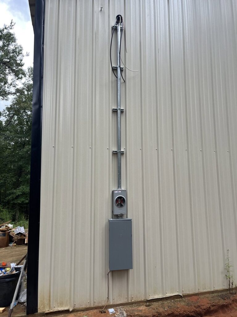 Electrical service installation on the side of a commercial building by Spencer Electric in Hopkins, MN.