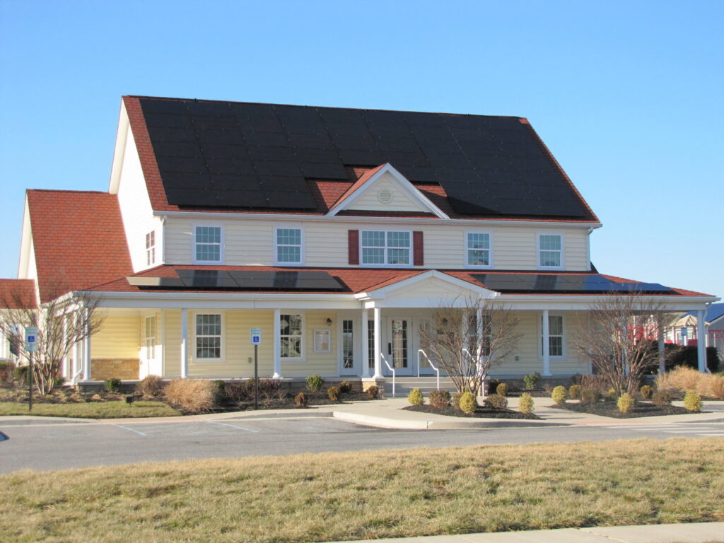 Commercial solar panel installation on a large building by CMI Solar & Electric, Inc. in Newark, DE.