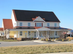 Commercial solar panel installation on a large building by CMI Solar & Electric, Inc. in Newark, DE.