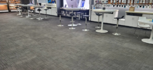 Freshly cleaned commercial carpet tiles in a business setting by Leiter's Carpet Cleaning in Fort Wayne, IN.