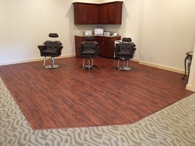 Commercial carpet and wood-look luxury vinyl tile installed in a salon by RugSale by Kaoud Rugs in West Hartford, CT