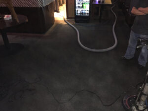 Professional carpet cleaning equipment and hoses in a commercial space by C&C Carpet Care LLC in Columbia, MO.