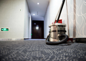 Professional carpet cleaning equipment ready for use in a commercial hallway by Carpet Cleaning & More in Atlanta, GA.